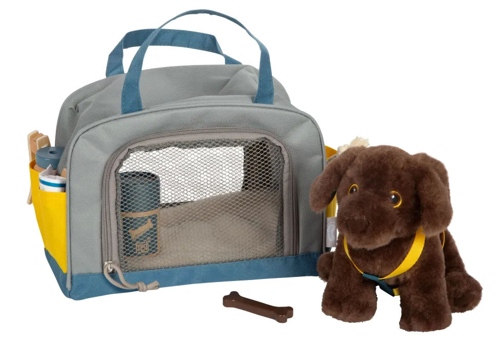 Hund mit Tasche und Pflege-Set