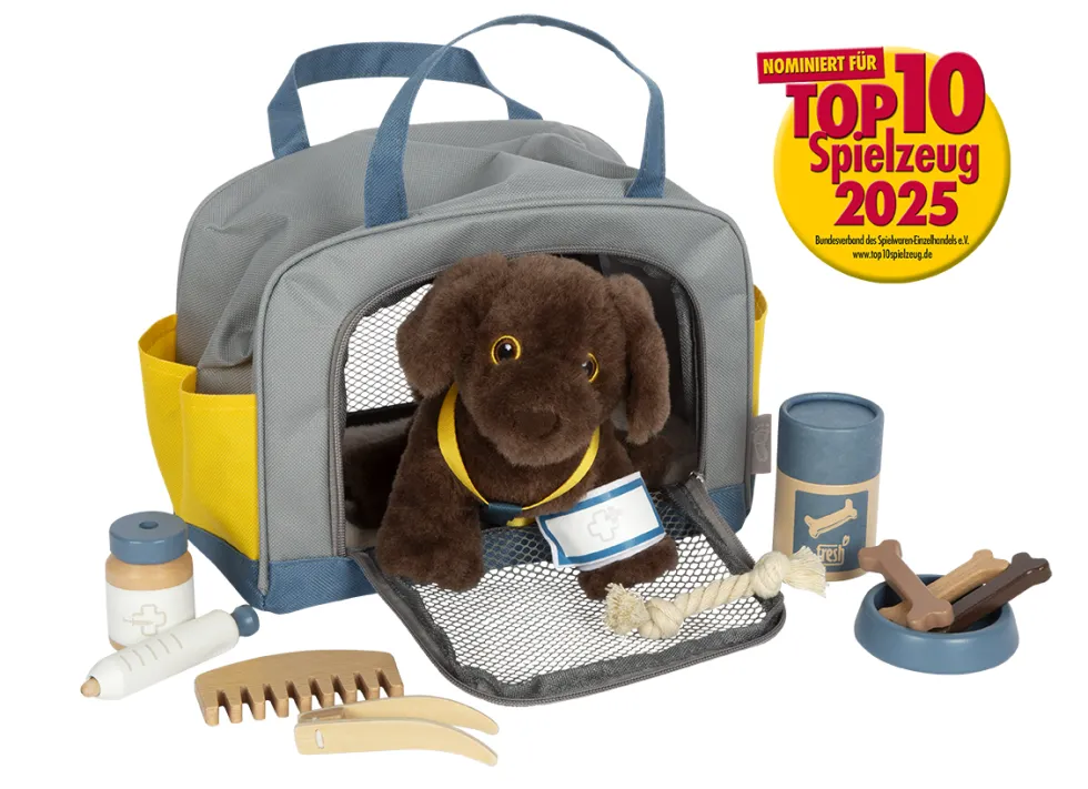 Hund mit Tasche und Pflege-Set